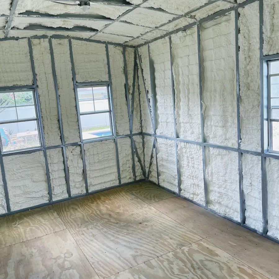 Closed-cell spray foam insulation applied to wall cavities in a residential project in Enumclaw